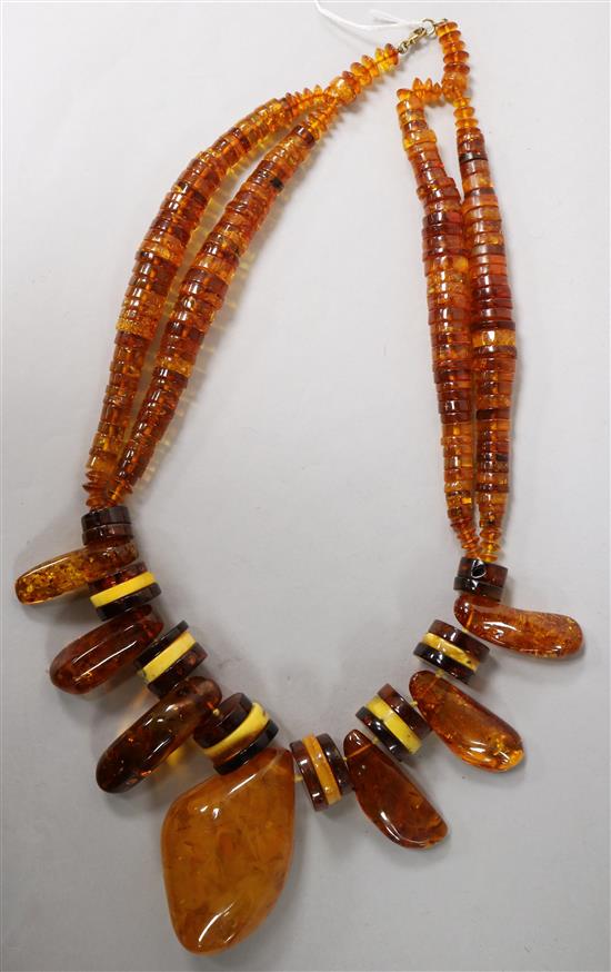 A large amber necklace, with assorted shaped beads,